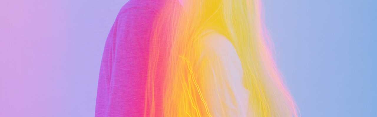 Colorful conceptual art showing two people turned away, visually representing emotional separation