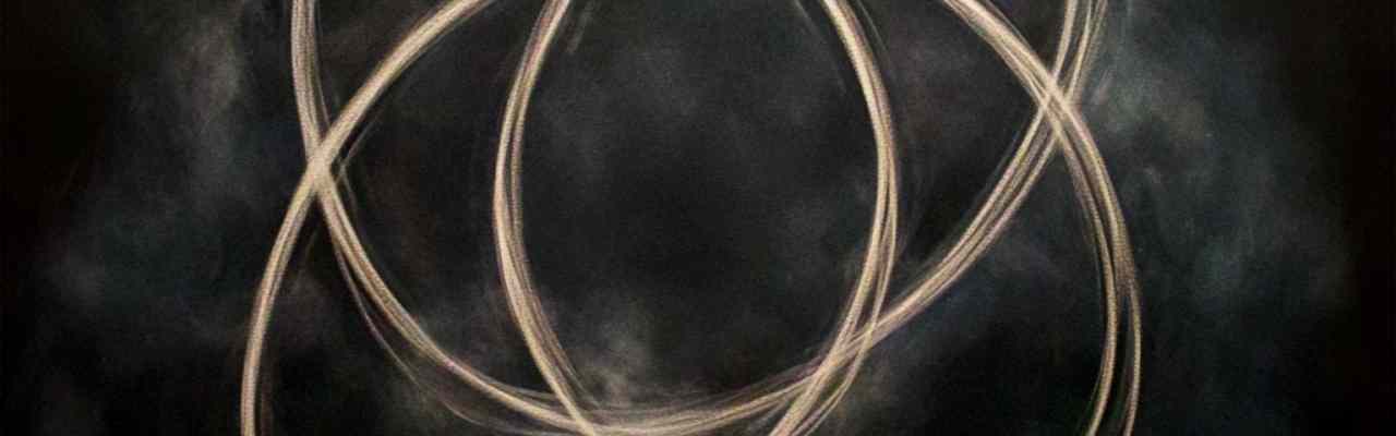 Intertwining energy circles representing connection experienced in OM peak meditation.