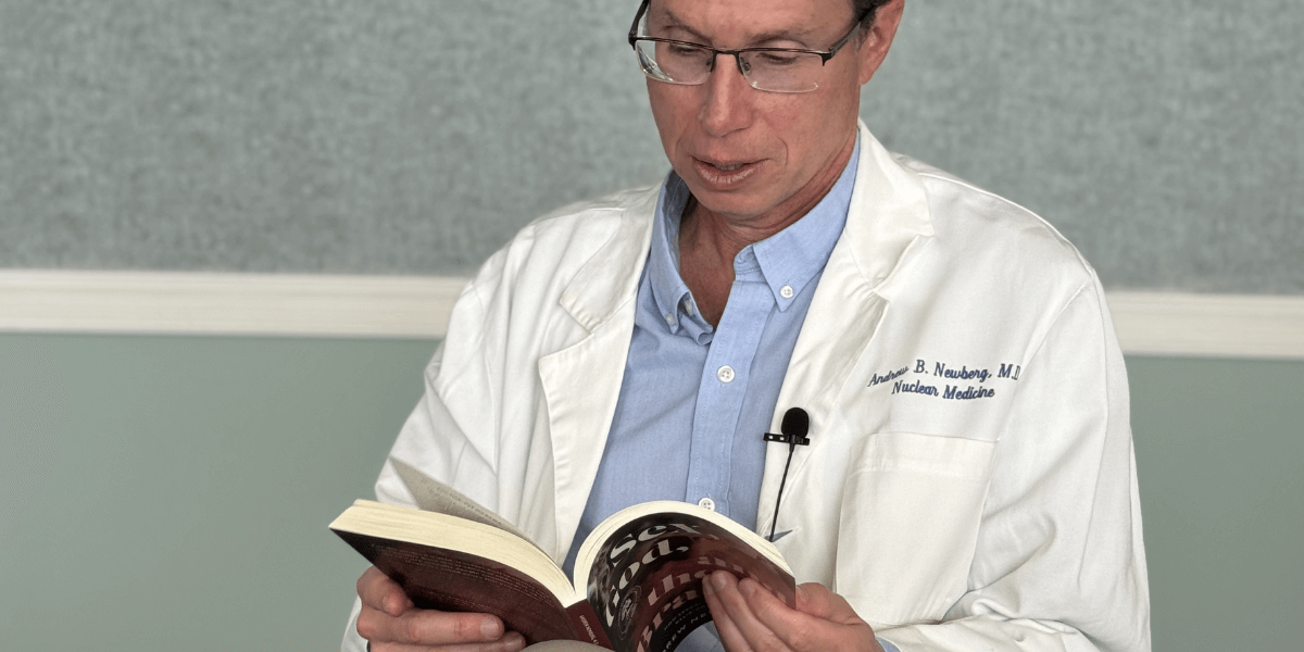 Dr. Andrew Newberg reading 'Sex, God, and the Brain,' a book on the brain exploring the connection between sexuality and spirituality